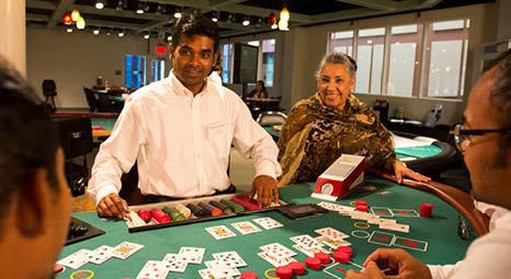 Dealer at roulette wheel in a casino