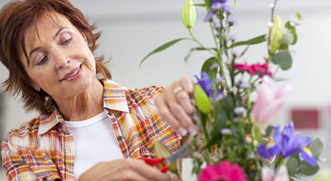 a woman arranging flowers